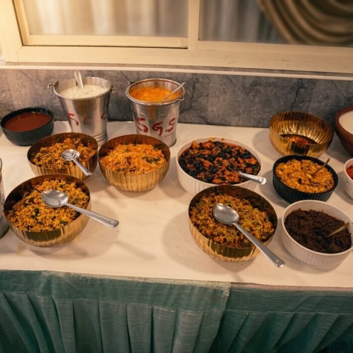 Andhra-style buffet spread with curries and rice at a Sri Sai Manikanta Caterers event