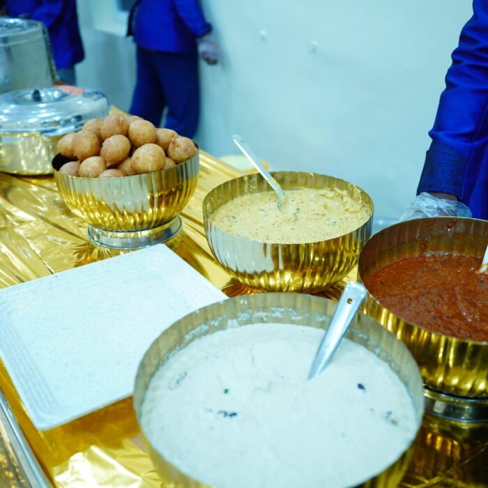 Chutney and dip counter being served by catering staff