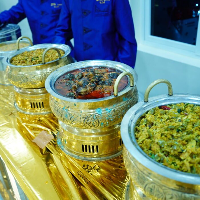 Live rice and curry counter served by catering staff